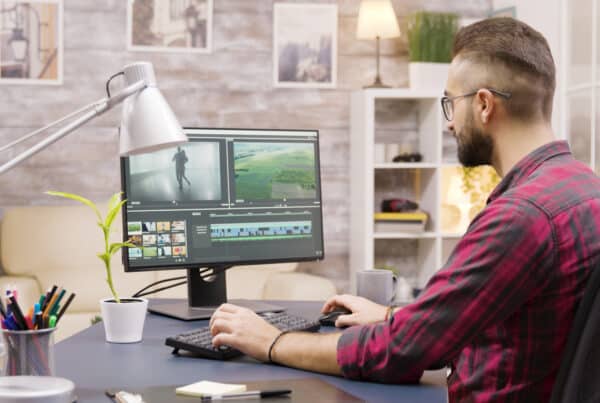 man editing in computer