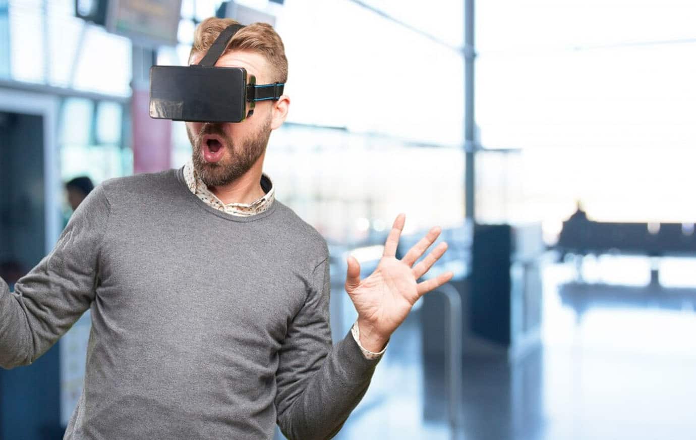 man at terminal using vr