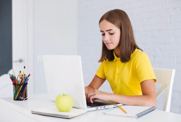 teen using laptop