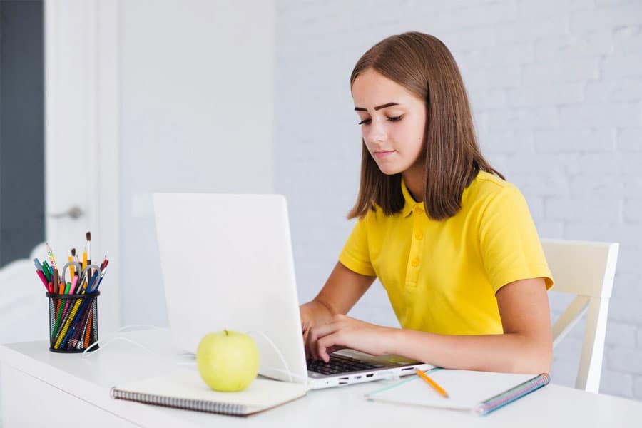 teen using laptop