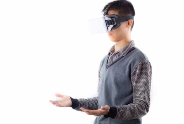 man standing wearing vr