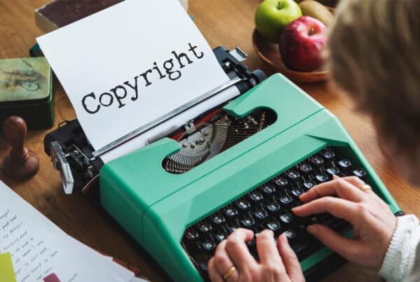 woman typing in a typewriter